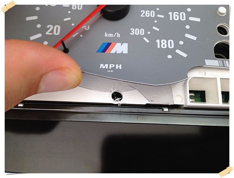 Hole under Tachometer